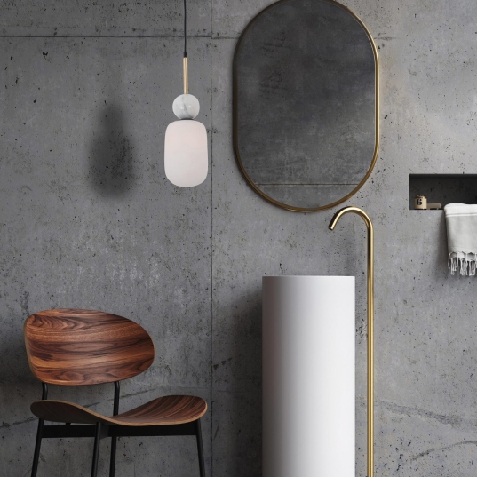 Bathroom sink area, minimalist. Espefo and faucet in gold color. Natural lighting through the entrance through the large window with a wooden frame. Parquet flooring in dark color